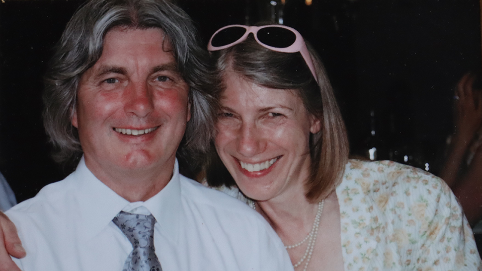 Married couple, Adrian and Tess, smiling at camera