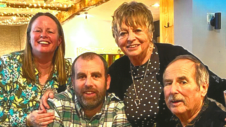 Family photo of mum, dad, son and daughter celebrating 50th wedding anniversary